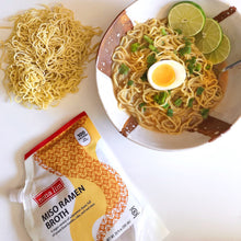 Nona Lim Miso Ramen Broth Pouch with bowl of ramen noodles and soft boiled egg